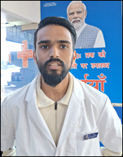 A person in a white coatDescription automatically generated