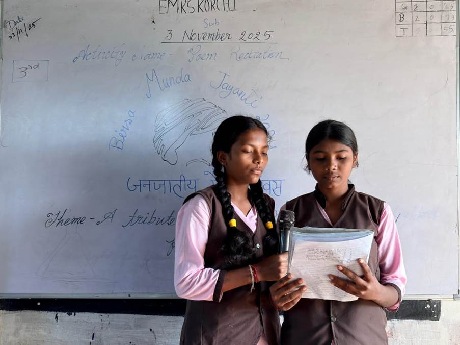 A couple of girls standing in front of a white boardAI-generated content may be incorrect.