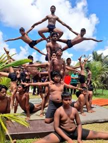 A group of men standing on top of each otherAI-generated content may be incorrect.