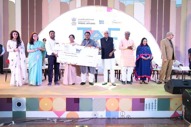 A group of people on a stageAI-generated content may be incorrect.