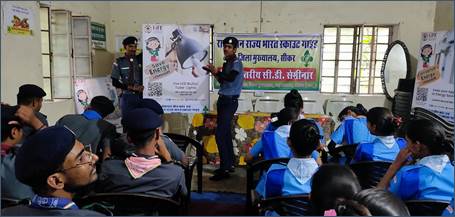 A person in uniform standing in front of a group of peopleDescription automatically generated with medium confidence