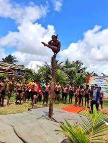 A group of people standing around a poleAI-generated content may be incorrect.