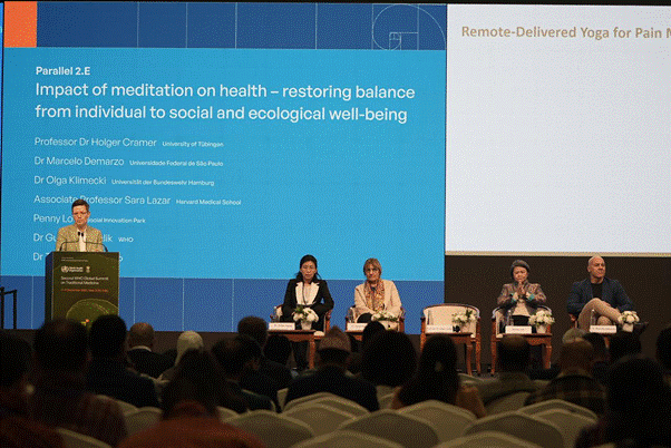 A group of people sitting on a stageAI-generated content may be incorrect.