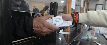 A person handing over a card to another personDescription automatically generated