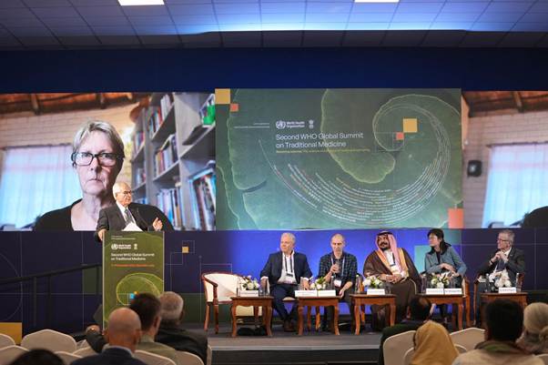 A group of people sitting on a stageAI-generated content may be incorrect.