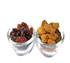 Raisins in glass bowl on white