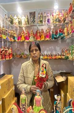 A person holding a dollAI-generated content may be incorrect.